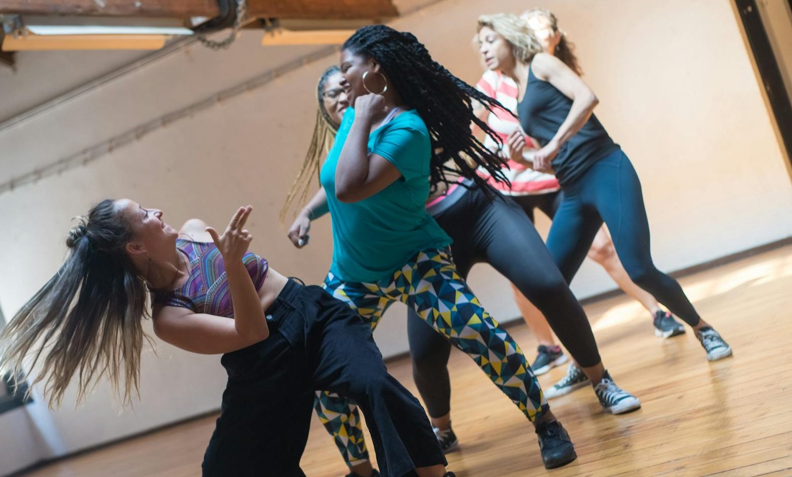 group of women dancing during a dance class